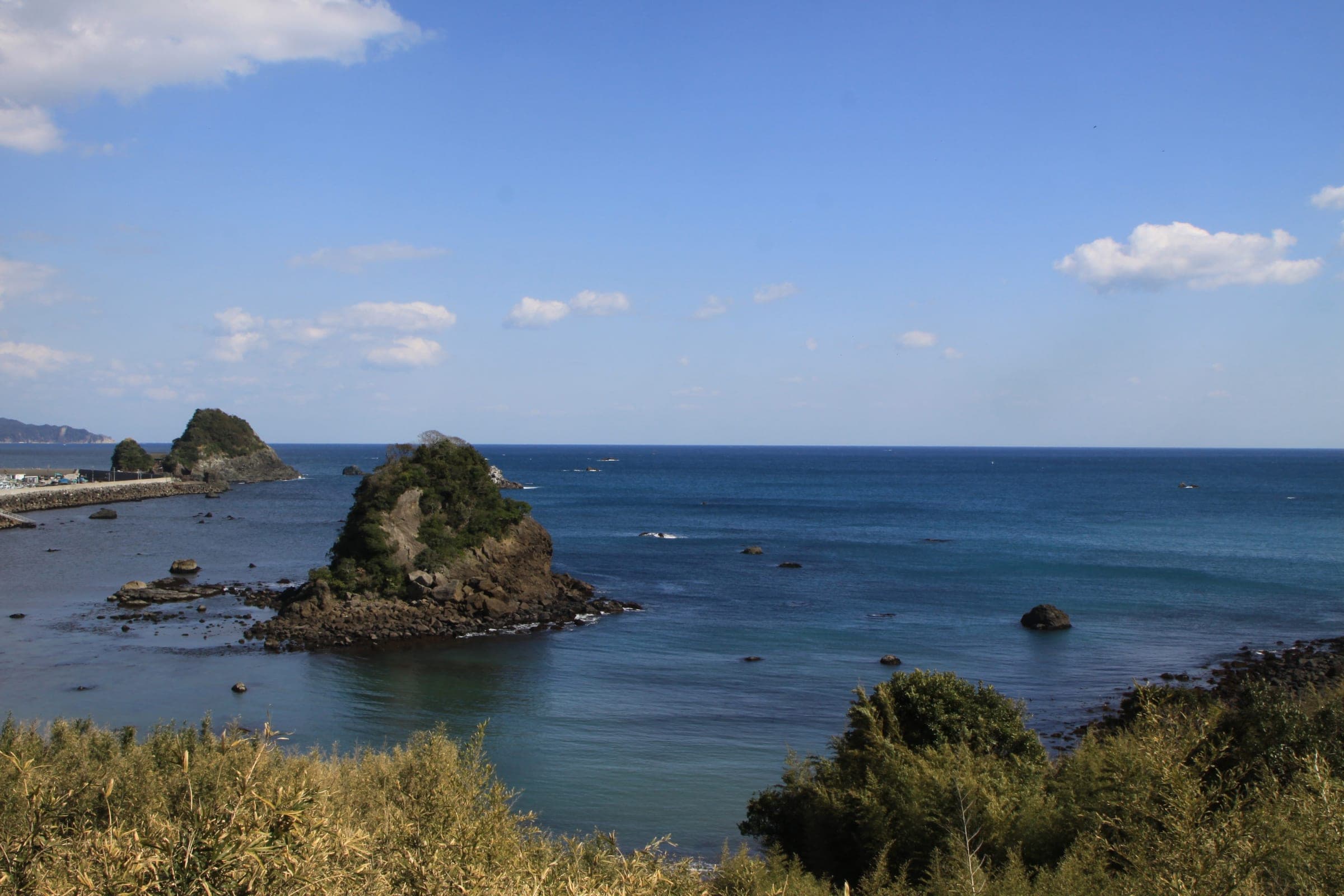 Rocky islets of Kamogawa Matsushima sit in a calm blue Pacific off the Boso Peninsula coast